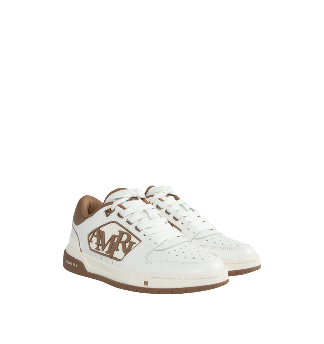 Image 2 of 5 - BROWN - AMIRI Classic Leather Logo Low-Top Sneakers featuring rubber logo inserts on the sides, star-shaped perforations, flat heel, round toe, lace-up vamp, MA logo on the tongue, padded collar for comfort, raised backstay logo, rubber outsole and polyester lining.  