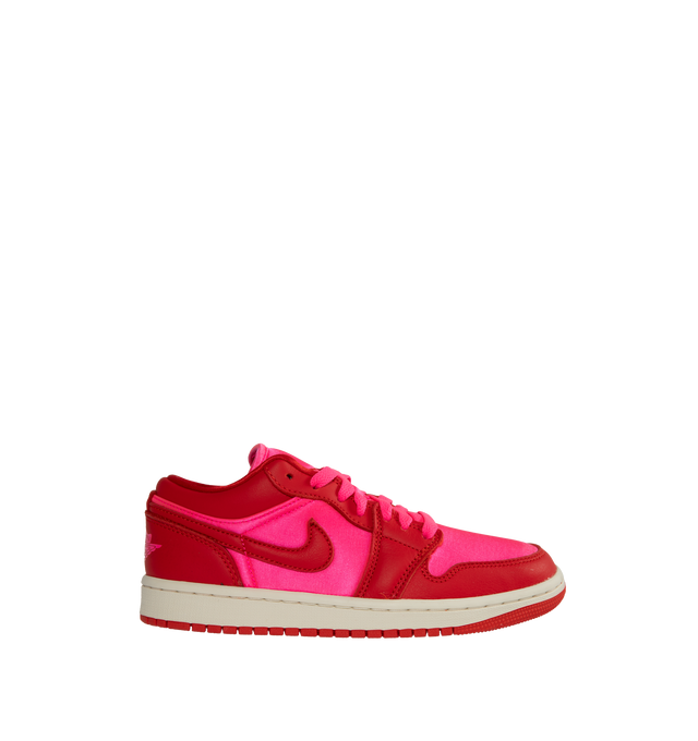 PINK - AIR JORDAN 1 LOW SE Women's Sneakers inspired by the original that debuted in '85. Crafted with full-grain leather overlays and satin underlays.  Encapsulated Nike Air-Sole unit provides lightweight cushioning. Outsole enhances traction on various surfaces.