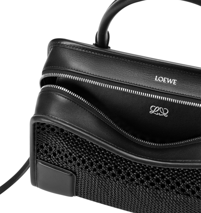 Image 9 of 14 - BLACK - Loewe Women's Medium Amazona 180 Bag is crafted from woven nappa calfskin and features a relaxed silhouette inspired by one of the house's iconic designs. Designed with a single Toron top handle and removable shoulder strap, it can be carried by hand, over the shoulder, or crossbody. A concealed magnetic closure, zip fastening with dual leather pullers, two compartments, an internal flat pocket, and a side D-ring provide functional organization. Finished with palladium-tone hardware, 