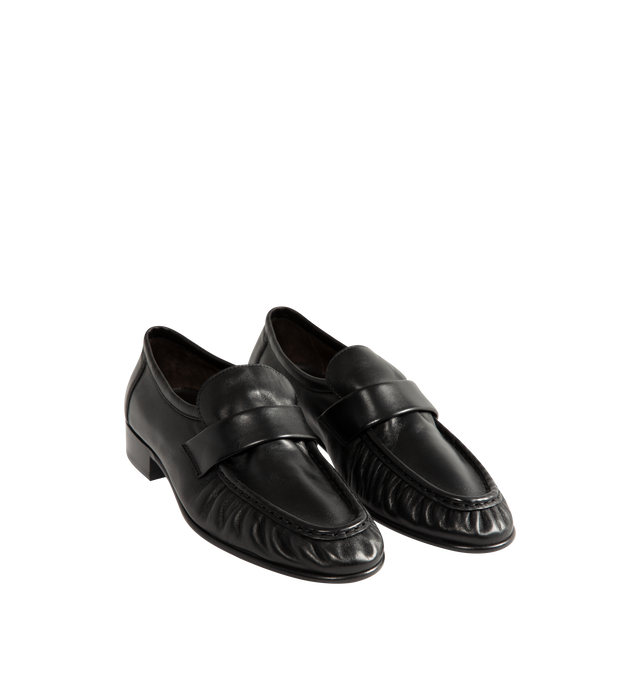 Image 2 of 4 - BLACK - The Row womne's artisanally-crafted loafer in soft nappa leather with natural pleating effect and hand-painted leather sole. 0.75 in. heel. 100% Lambskin Leather. Made in Italy. 
