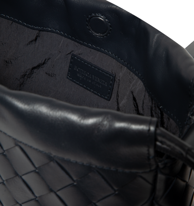 Image 3 of 3 - BLACK - Bottega Veneta Men's Dustbag Bike Pouch is crafted in Intrecciato calf leather with drawstring closure and adjustable cross-body strap with one main compartment. Drawstring and magnetic closure, Adjustable cross-body strap, Hardware: Silver finish, Lining: Nylon. Made in: Italy 