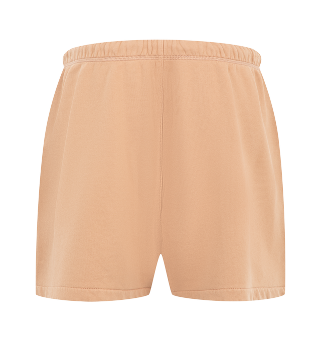 Image 2 of 3 - ORANGE - Fear of God Essentials Womens Classic Sweatshorts are crafted from heavyweight cotton fleece with a pigment-dyed finish. Feature a relaxed classic fit, elasticized waistband with adjustable drawcord and bungee, side-seam pockets, and signature Essentials label. Main Material: 100% Cotton. Imported. 