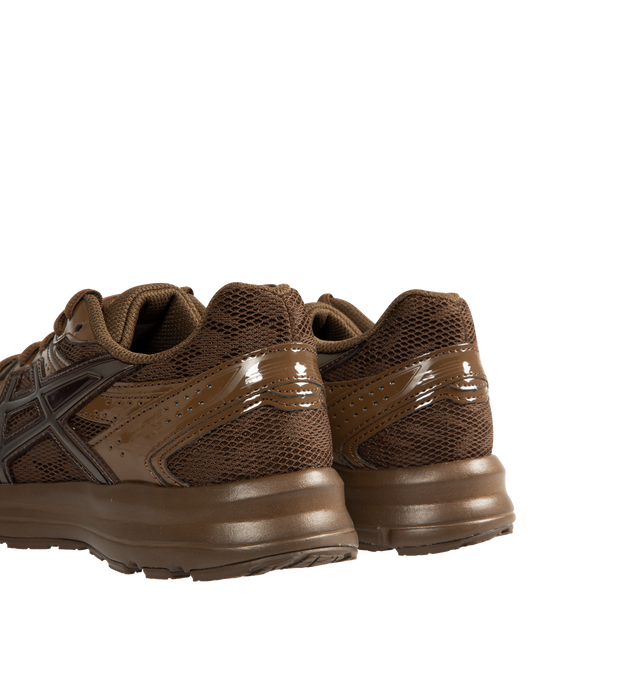Image 3 of 5 - BROWN - ASICS Jog 100S Sneaker featuring mesh and leather upper with rubber sole, lace-up front, formed with a one-piece EVA foam platform, OrthoLite sockliner and padded low-cut collar. 