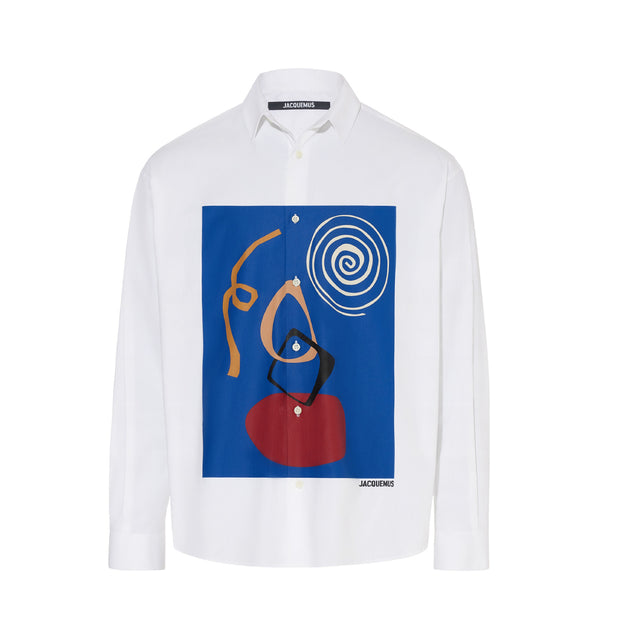 Image 1 of 1 - WHITE - JACQUEMUS La chemise Simon Shirt featuring cotton poplin, spread collar, button closure, graphic printed at front, shirttail hem, vented side seams, single-button barrel cuffs and mother-of-pearl hardware. 100% cotton. Made in Portugal. 