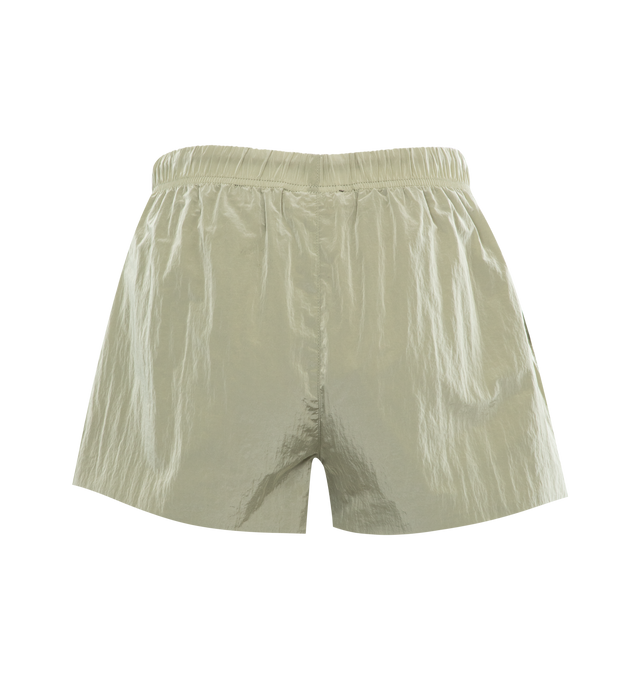 Image 2 of 3 - GREEN - FEAR OF GOD ESSENTIALS Crinkle Nylon Running Shorts featuring a relaxed fit, lightweight crinkle nylon construction, a rubber brand label on the front, side hand pockets, and an adjustable drawstring waistband. 100% nylon. 