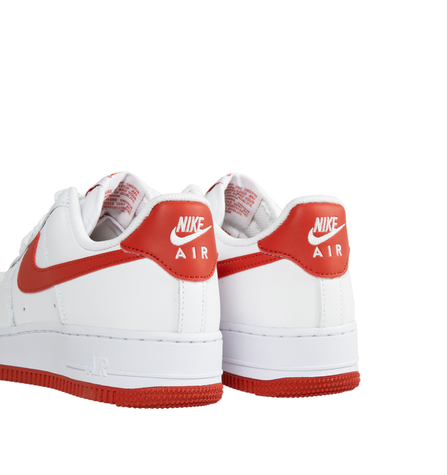 Image 3 of 5 - WHITE - NIKE Air Force 1 '07 lace-up sneakers in white with Dragon Red swoosh featuring padded collar, leather and textile upper, textile lining and Dragon Red rubber sole. 