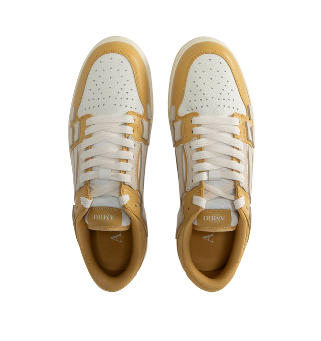 Image 5 of 5 - NEUTRAL - Amiri Men's Quad Skel Top Low Sneakers are a lace-up style with perforation details, signature graphics, leather appliques, and two-tone rubber soles. Leather uppers. Made in Vietnam. 