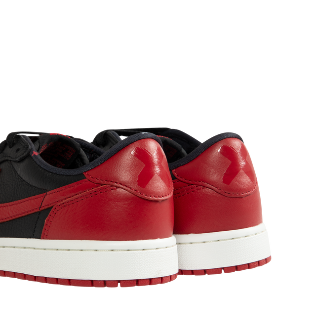 Image 3 of 5 - MULTI - Men's Air Jordan 1 Retro Low OG Sneakers feature a smooth leather upper with the iconic low-top silhouette and signature X graphics on the heel, honoring one of the most legendary colorways in Jordan history. These lifestyle sneakers combine encapsulated Air-Sole cushioning, a responsive foam midsole, and a durable rubber outsole for lightweight comfort, lasting support, and reliable everyday traction. Main Material: Leather. Midsole: Foam with Encapsulated Air-Sole Unit. Sole: Rubber 