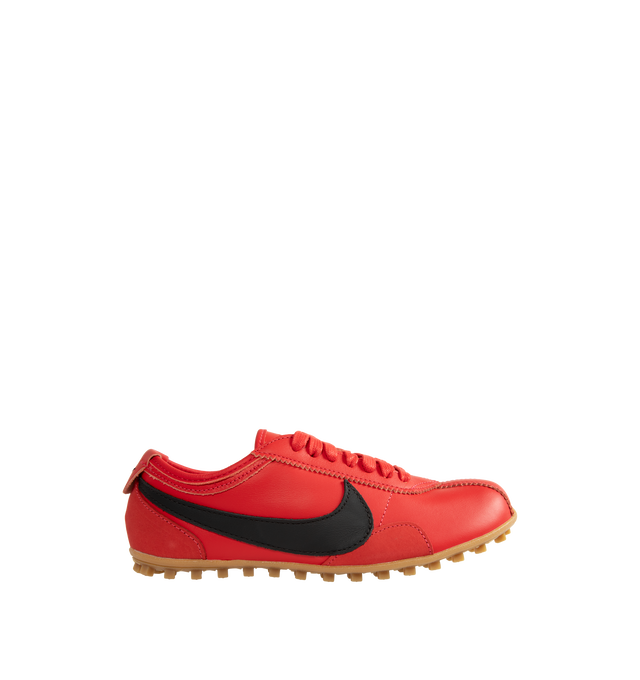 Image 1 of 5 - RED - Nike Women's Moon Shoe Sneakers are designed with a premium full-grain leather upper and the brand's iconic Waffle outsole, this heritage-inspired style captures the look and feel of a classic 1970s runner while delivering everyday comfort and durability. Main Material: Full-Grain Leather Upper. Outsole: Rubber Waffle Sole. 