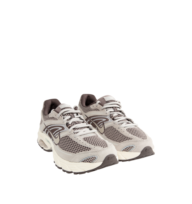 Image 2 of 5 - NEUTRAL - Nike Air Max Moto 2K Men's Sneakers feature a layered upper crafted from synthetic leather and textile with metallic accents for a modern, Y2K-inspired look. These performance-inspired lifestyle sneakers combine Max Air cushioning, a lightweight foam midsole, and a durable rubber outsole for all-day comfort and reliable traction. Main Material: Synthetic Leather and Textile. Midsole: Foam. Sole: Rubber. 