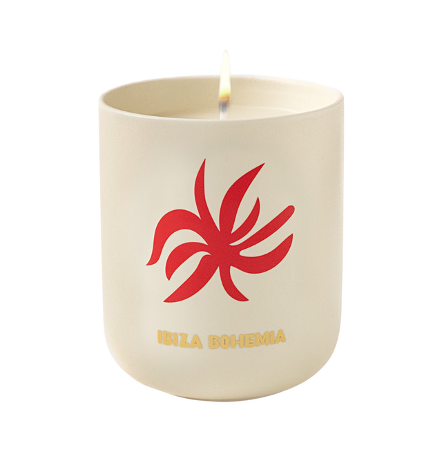 Image 2 of 4 - MULTI - Assouline Ibiza Bohemia - Travel From Home Candle. Bask in an Ibiza sunrise glittering over ocher sands with a mlange of lemon, bergamot, green apple, and patchouli, capturing the essence of carefree mornings and the enchanting rhythm of island life. Material: Ceramic Vessel. Wax Family: Soy, Coco, Paraffin Blend. Approximate Burn Time: 50 Hours. Weight: 11.25 oz (318.02 g). Dimensions: 4 x 3.37 in (10.16 x 8.56 cm). 