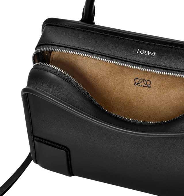 Image 12 of 17 - BLACK - Loewe Amazona Medium 180 Bag in soft calfskin leather featuring a relaxed silhouette with a single toron top handle, designed to be carried open, while a concealed closure secures the main compartment, removable shoulder and crossbody straps, zip closure with two leather zip pullers, two compartments, main compartment closed with magnetic closure, internal flat pocket, suede lining and embossed logo. Soft calfskin. Strap length 108 cm; Strap Drop 50 cm; Handle drop 11 - 28 cm; Heigh 