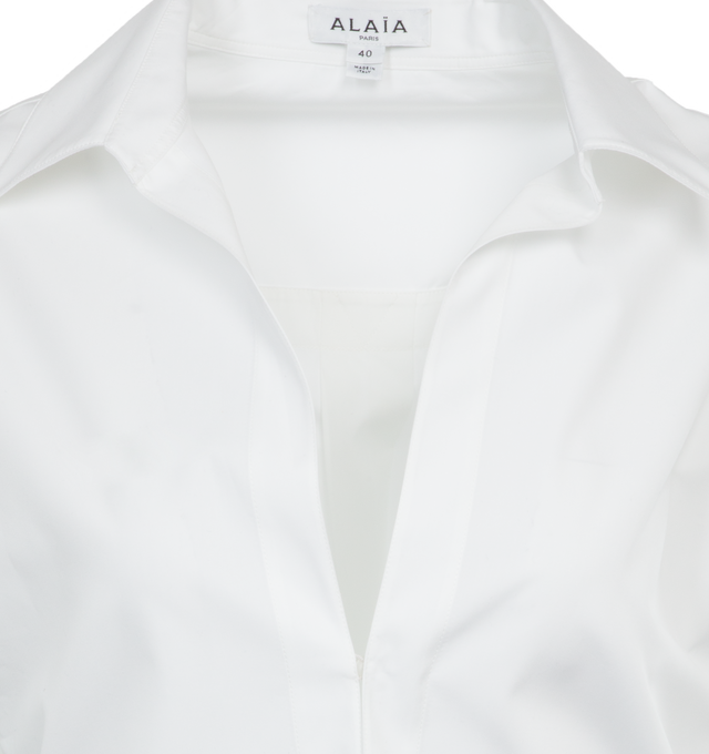 Image 3 of 3 - WHITE - ALAIA Shirt Bodysuit featuring plunging neckline body shirt, cinched waist, cheeky culotte in knit and long sleeves. 100% cotton. Made in Italy. 