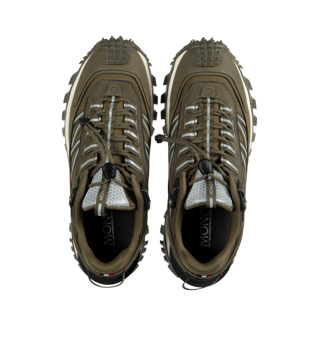Image 5 of 5 - GREEN - MONCLER Trailgrip Sneakers featuring nubuck upper, mesh insole, lace closure, TPU spoiler, EVA midsole, carbon fiber between midsole and tread, vibram MEGAGRIP tread and ortholite insert. Sole height: 4.5 cm. 100% polyester. Lining: 100% polyamide/nylon. Sole: 100% elastodiene. Made in Vietnam.  