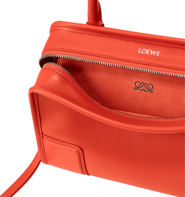 Image 12 of 17 - ORANGE - Loewe Small Amazona 180 Bag in leather features a relaxed silhouette anchored by a single toron top handle, designed to be carried open, while a concealed closure secures the main compartment, three carry options: short handle, removable shoulder strap and crossbody, zip closure with two leather zip pullers, two compartments, main compartment closed with magnetic closure, internal flat pocket, left side d-ring for customization, nappa lambskin lining, and embossed double L branding 