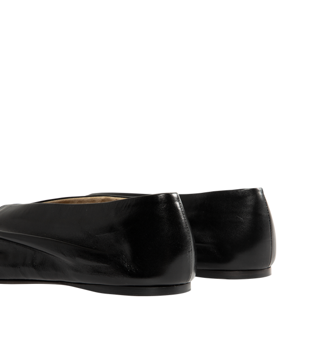 Image 3 of 4 - BLACK - Khaite Miriam ballerina flat inspired by the soft folds of fabric and crafted in Italy of glazed calfskin selected for its luminous shine. The deconstructed body is lined in cigar-hued suede, accentuating a natural fit that moves with the foot. Detailed with signature gold staple. Made in Italy. Glazed calf (100% calfskin). 