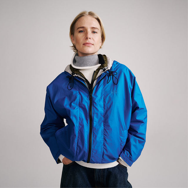 Image 4 of 4 - BLUE - Loewe Womens Technical Jacket is crafted from lightweight technical shell with a triple-layer construction. Features a relaxed fit, regular length, zip-up neckline with hood, front welt pockets, elasticated hem with drawstring, and Double L embroidery at the chest. Main Material: Polyamide / Polyurethane. Made in Italy. 