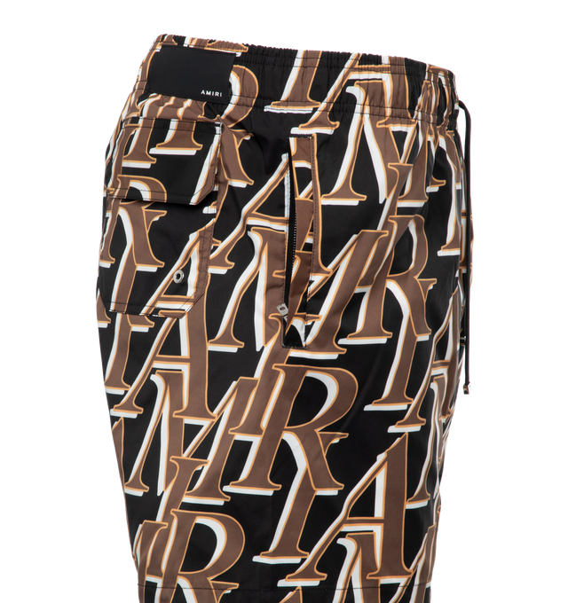 Image 3 of 4 - BLACK - AMIRI stacked logo print swim trunks featuring adjestable drawcord. Made in Italy. 90% Polyester / 10% spandex. 