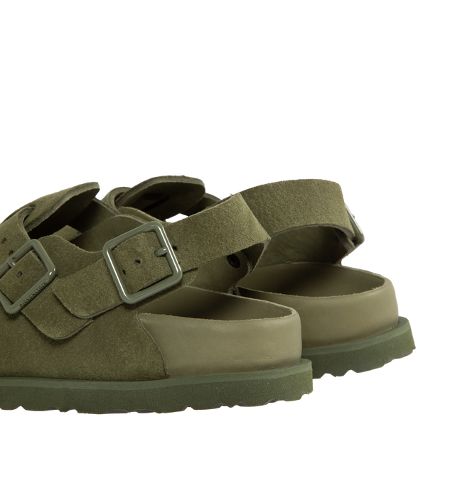 Image 3 of 4 - GREEN - Birkenstock's Tokio a closed-toe clog in a narrow width. The iconic Tokio sillhouette closely follows the contours of the foot featuring adjustable heel and arch straps. Upper: Luxurious fine flesh out suede, a full grain leather that has been flipped to use the fuzzy side. Footbed: Anatomical shaped BIRKENSTOCK cork-latex footbed, covered with premium, color-matching smooth nappa leather. Sole: EVA outsole with a 3mm EVA welt updates the standard die-cut outsole while still ensuring  