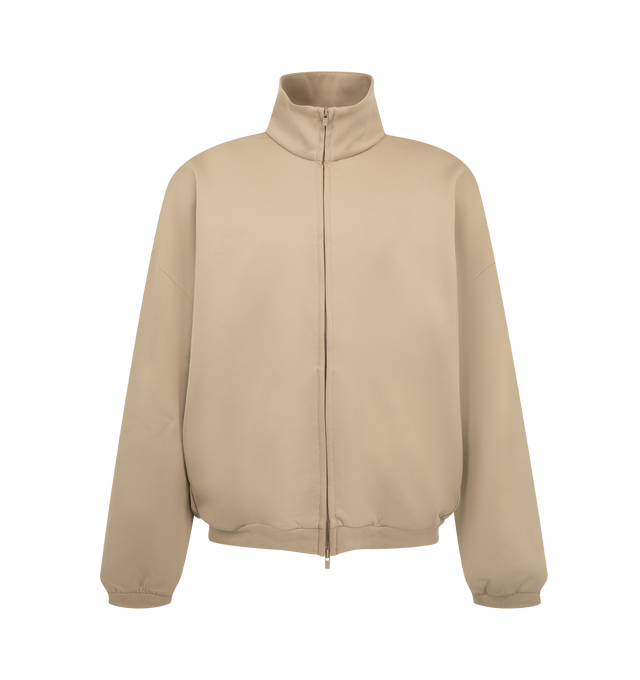 Image 1 of 3 - NEUTRAL - Fear of God ESSENTIALS Men's Tricot Modern Track Jacket is crafted from durable tricot knit and features a modern athletic silhouette with a full-zip front closure and high neckline. Designed for flexibility, comfort, and everyday performance, this elevated track jacket is detailed with dual embroidered logos at the front shoulders, side pockets, rib-knit cuffs and hem, and a signature label at the back. Main Material: 93% Polyester, 7% Elastane Tricot Knit.  