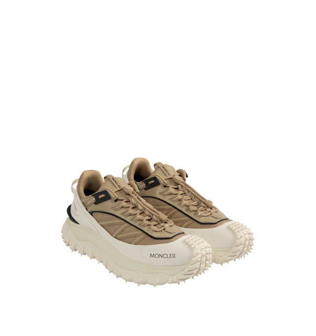 Image 2 of 5 - WHITE - Moncler Trailgrip GTX Low Top Sneakers are a lace-up style with a mix of technical materials, GORE-TEX waterproof membranes, EVA midsoles, Vibram treads, and OrthoLite insoles. Made in Vietnam. 