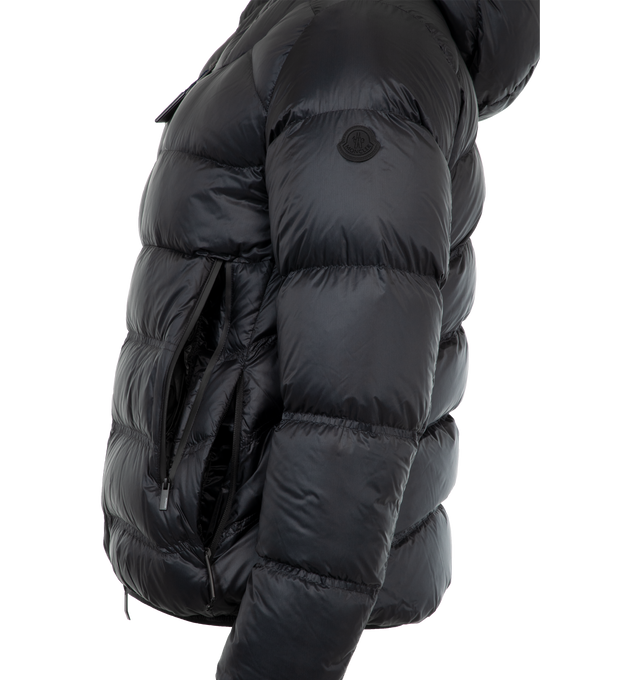 Image 3 of 3 - NAVY - Moncler Viani Down Jacket is crafted in ripstop fabric with a micro soft technique lining, rubberized logo patch, Elastic trim hood, and boxy waistline. It also has a 2 way zip front closure, zip pockets, elastic wrists, and an elastic hem. 100% polyamide. 90% goose down, 10% feather. Made in Romania. 