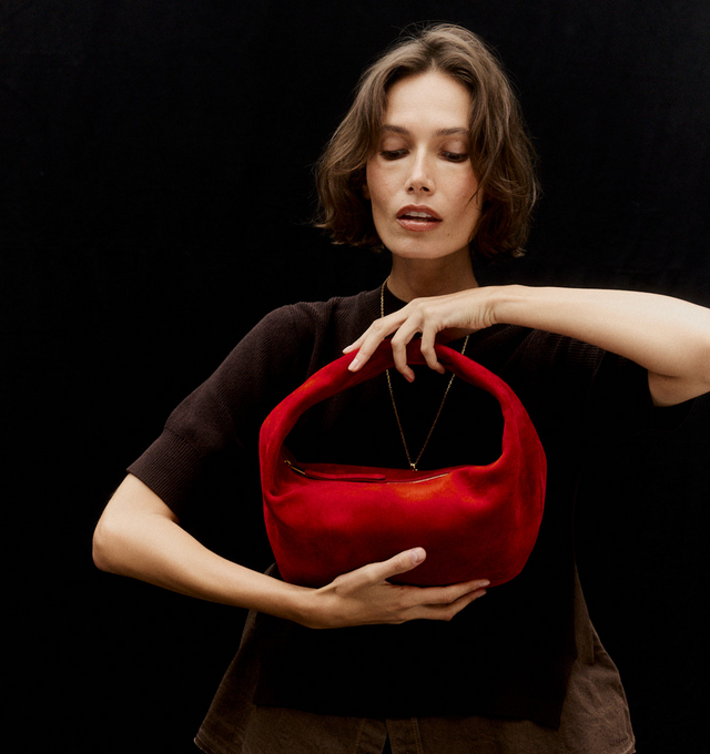 Image 3 of 5 - RED - Khaite Olivia slouchy zip-top hobo bag in velvety suede. With integrated strap to wear over the shoulder or carry by hand. Signature hardware at zipper pull. Suede (100% kid leather). Made in Italy. 