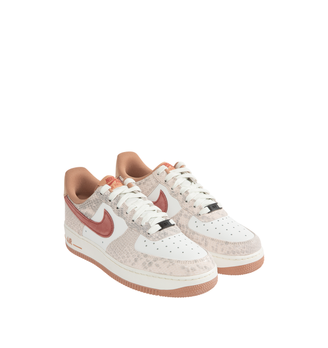 Image 2 of 5 - PINK - NIKE Air Force 1 '07 LV8 Sneaker featuring leather upper with a perforated toe box, Nike Air cushioning, rubber outsole with heritage hoops pivot circles, suede Swoosh logo, padded collar and foam midsole. 