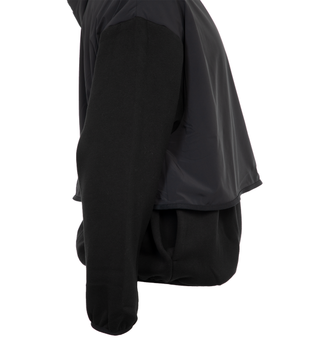 Image 3 of 4 - BLACK - FEAR OF GOD ESSENTIALS Nylon Fleece Hooded Sweater featuring elastic cuffs and hem, side pockets, rubber logo on front and nylon shell and hood. 80% cotton, 20% polyester. 