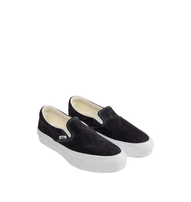 Image 2 of 5 - BLACK - VANS LX Classic Slip-On 98 Sneakers featuring canvas slip-on sneakers, elasticized gussets at vamp, padded collar, logo flag at outer side, rubber logo patch at heel, grained leather and canvas lining, textured rubber midsole, treaded rubber sole and contrast stitching in white. Upper: textile. Sole: rubber. Made in Philippines. 