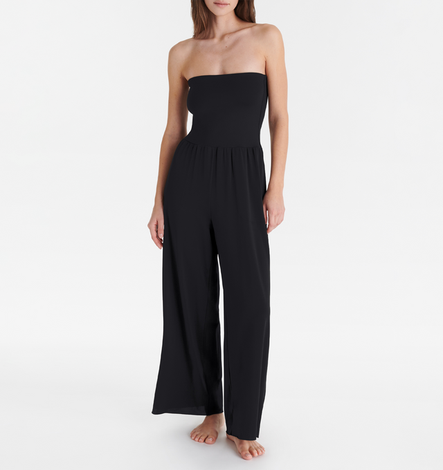Image 3 of 5 - BLACK - ERES Dao High-Waisted Trousers featuring wide legs and side pockets with tone on tone stitching. Offers versatile styling to wear as a bustier jumpsuit or pants.  Main: 94% Polyamid, 6% Spandex. Second: 84% Polyamid, 16% Spandex. Made in France. 
