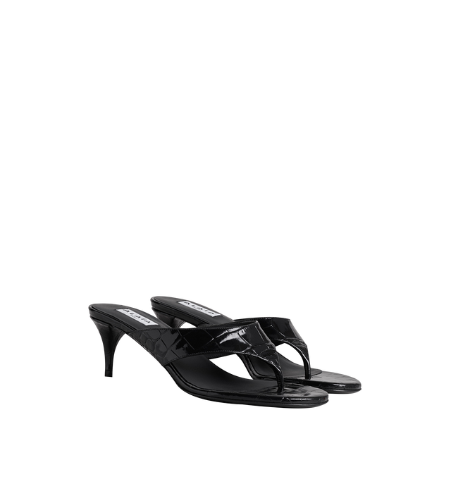 Image 1 of 1 - BLACK - Alaa Women's Crocodile-Embossed Calfskin Thong Mules are crafted from shiny cherry calfskin with a crocodile-effect finish. The slip-on silhouette features a thong design and slender stiletto heel. Upper: 100% Calf Leather. Main Lining: 100% Lamb Leather. Sole: 50% Calf Leather, 50% Rubber. Heel Height: 55 mm / 2.2 in. Made in Italy. 
