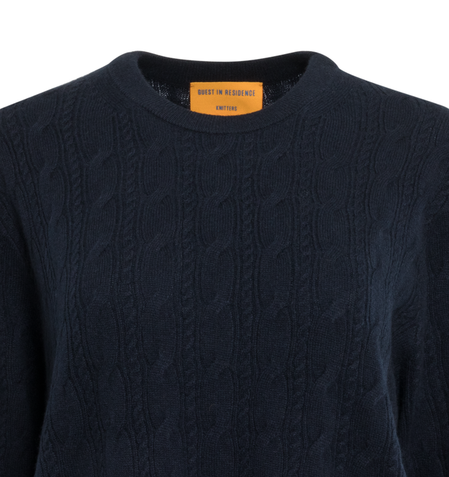 Image 3 of 3 - NAVY - GUEST IN RESIDENCE Twin Cable Crew featuring crew neck, all over double cable stitch, ribbed neck trim, cuff, and hem and integral knitted branding. 100% cashmere.  