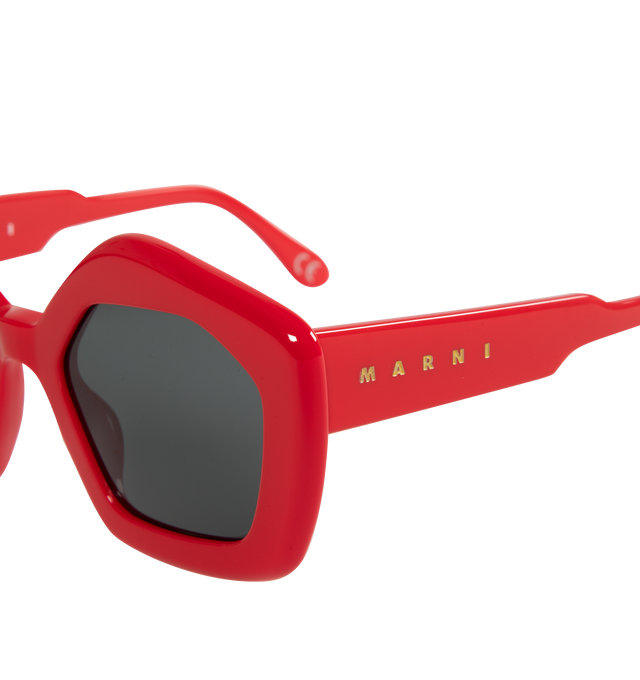 Image 3 of 3 - RED - MARNI SUNGLASSES LAUGHING WATERS featuring geometric pentagon frames and goldtone logo branding at the temples. Acetate. 