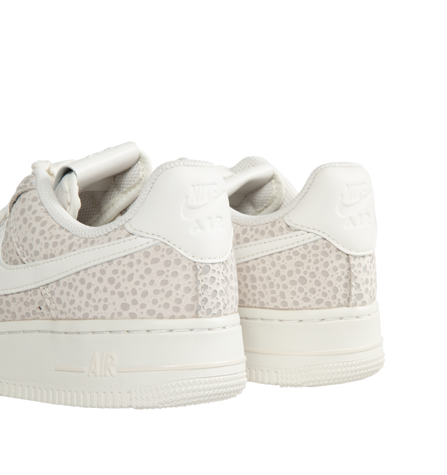 Image 4 of 5 - WHITE - Women's Air Force 1 '07 LX Low-top lace-up sneakers crafted from premium leather and textiles, with a foam midsole and rubber sole. Featuring iconic safari print  "Phantom White" leather upper and graphics,  padded collar,  white rubber outsole with Nike Air cushioning for lightweight, all-day comfort. 