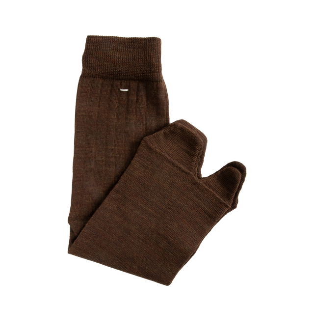 Image 2 of 2 - BROWN - Maison Margiela Tabi Socks are crafted from a wool-blend jersey and feature the Maison's iconic split-toe construction inspired by traditional Japanese tabi socks. Designed with ribbed cuffs, a mid-calf length silhouette, and the signature single white stitch at the back, these socks combine comfort with a distinctive archival design. Main Material: 78% Wool, 22% Polyamide. Made in Italy. 