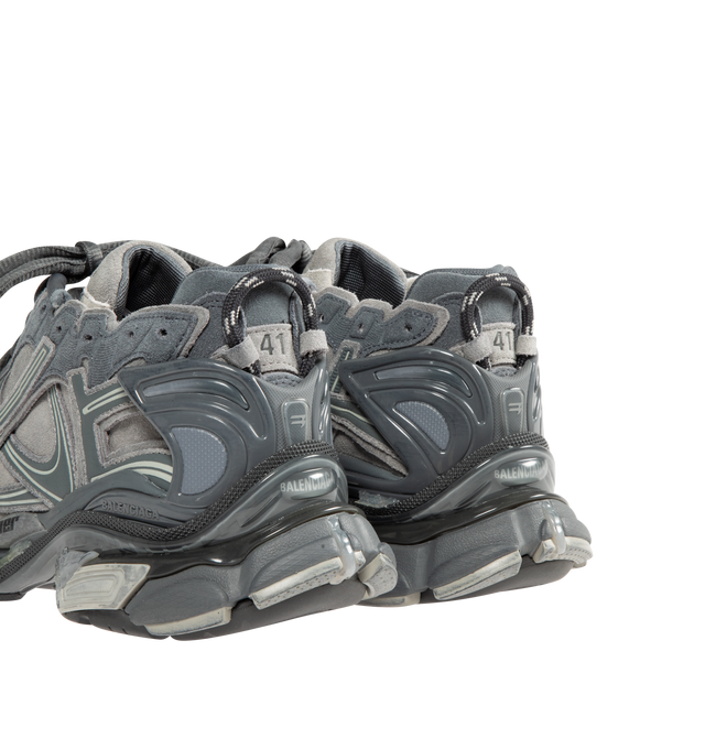 Image 3 of 5 - GREY - BALENCIAGA Runner Sneaker in grey suede cowskin, polyurethane and polyester featuring worn-out effect, printed size at the edge of the toe, debossed size at back, runner logo printed on exterior, Balenciaga logo embroidered on the tongue, Balenciaga logo at the back of the heel and Back pull-on tab. Upper: cowskin, polyurethane, polyester. Sole: rubber, TPU, EVA, polyurethane. Insole: foam. Made in China. 
