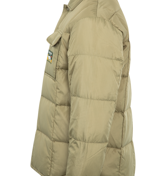 Image 3 of 3 - NEUTRAL - Human Made Down shirt jacket with a polar bear tag on the left chest pocket. Designed to be worn through to early spring, it can also be used as an inner down layer. MATERIAL: 100% POLYESTER. FILLING: 75% DOWN, 25% FEATHER. 