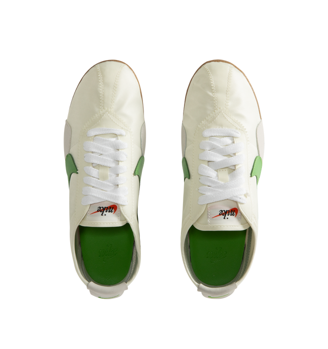 Image 5 of 5 - GREEN - Nike Men's Moon Shoe OG SP Sneakers feature a Sail, Light Bone, and Chlorophyll nylon upper with a leather Swoosh. Inspired by Nike's original 1970s running shoe, the streamlined silhouette is set on a rubber Waffle outsole for durable traction. Upper: Nylon and Leather. Sole: Rubber. 