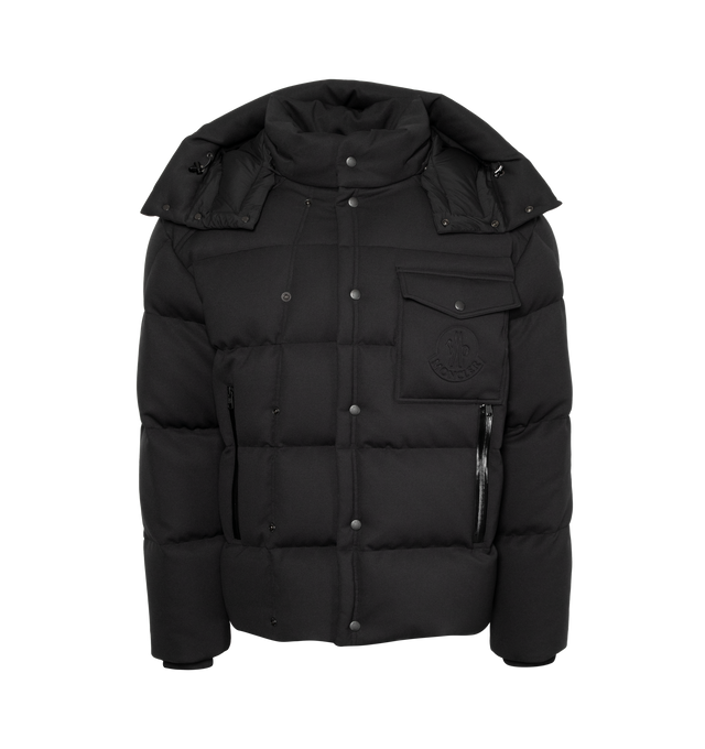 Image 1 of 4 - BLACK - A forward-looking design, the Moncler Karakorum is crafted from elastic technical jersey. Originally designed in 1954 for the first expedition to K2, Moncler Karakorum is created to withstand the harshest climates: the hood, zipper, and double button closure are there to keep you as warm as possible. Internal suspenders allow you to carry the down jacket on your back, giving you maximum freedom of movement. The jacket is adorned with a signature patch pocket on the chest, while the ba 