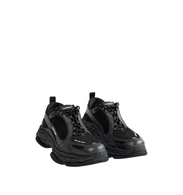 Image 2 of 5 - BLACK - Balenciaga Men's Triple S Clear Sole Sneaker is crafted from leather-free double foam and mesh and features the signature Triple S silhouette with a complex three-layer outsole incorporating Clear Sole technology. Detailed with an embroidered size at the toe edge, an embroidered logo at the side, an embossed logo at the back, and Triple S rubber branding at the tongue, this sneaker is finished with a 12-eyelet lacing system, bicolor hiking-inspired laces, an additional pair of laces,  