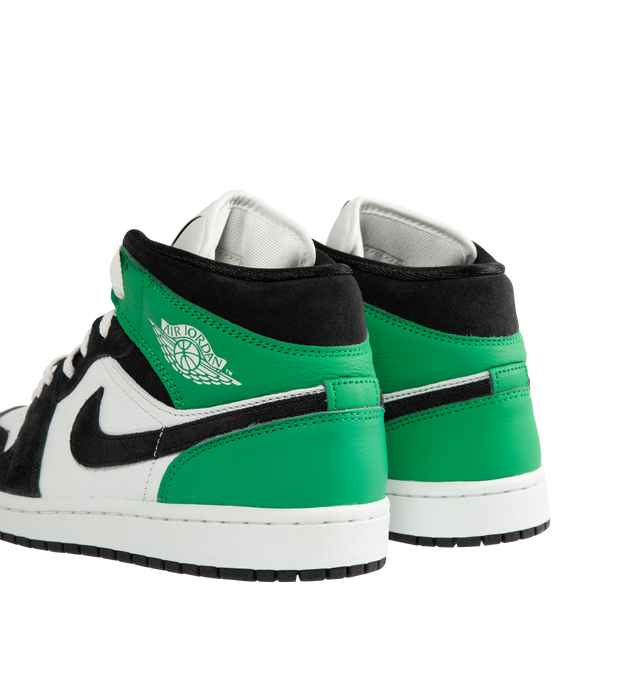 Image 3 of 5 - GREEN - Men's Air Jordan 1 Mid SE Sneakers feature a genuine leather upper with the iconic mid-top silhouette, signature Wings branding, and a stitched Swoosh for a timeless heritage look. These lifestyle sneakers combine encapsulated Air-Sole cushioning, a padded collar, and a durable rubber outsole for lightweight comfort, lasting support, and reliable traction. Main Material: Genuine Leather. Midsole: Encapsulated Air-Sole Unit. Sole: Rubber. 