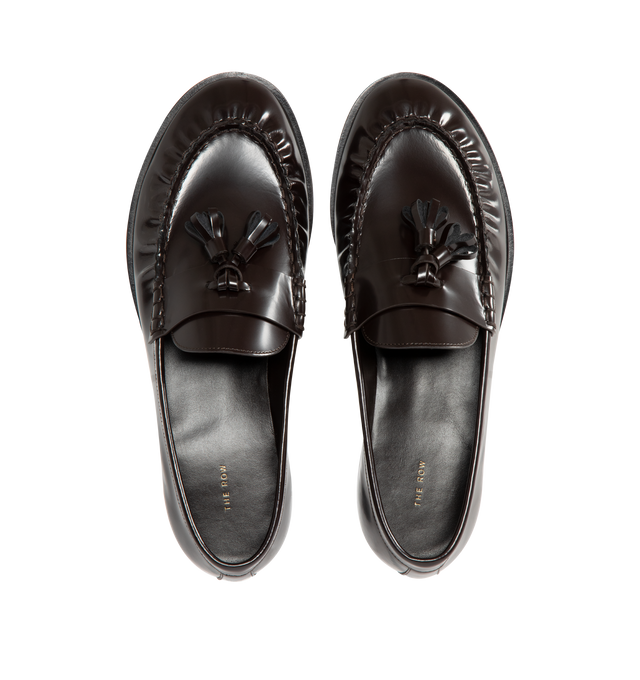 Image 4 of 4 - BROWN - THE ROW Loafer featuring sleek calfskin leather with natural pleating effect and tassel detailing. 100% leather. Made in Italy. 