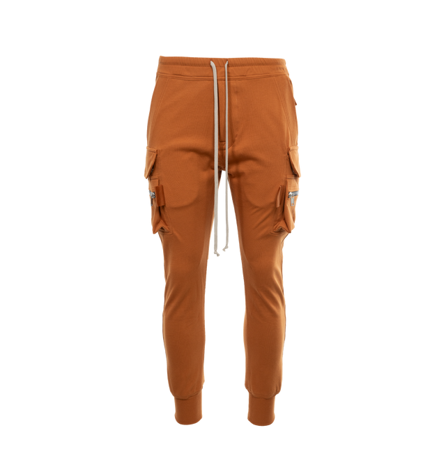 Image 1 of 3 - BROWN - RICK OWENS Mastodon Cargo Sweatpants featuring elasticated drawstring waist, tapered leg, side slit pockets, back pockets and zipped pockets. 100% cotton. 