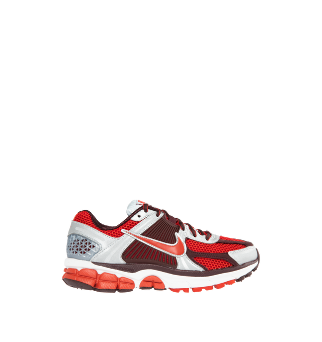 RED - NIKE Vomero 5 featuring leather on upper, mesh panels and ventilation ports on heel, Zoom Air cushioning, plastic caging on side, rubber outsole and reflective details. 