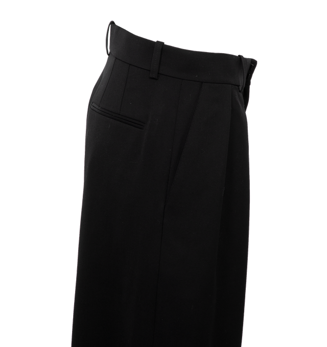 Image 3 of 4 - BLACK - WARDROBE.NYC Low Rise Trousers featuring pleated waist, hook-and-eye closures at waist, zip fly, wide-leg silhouette, slant hip pockets and faux welt back pockets. 100% wool. 