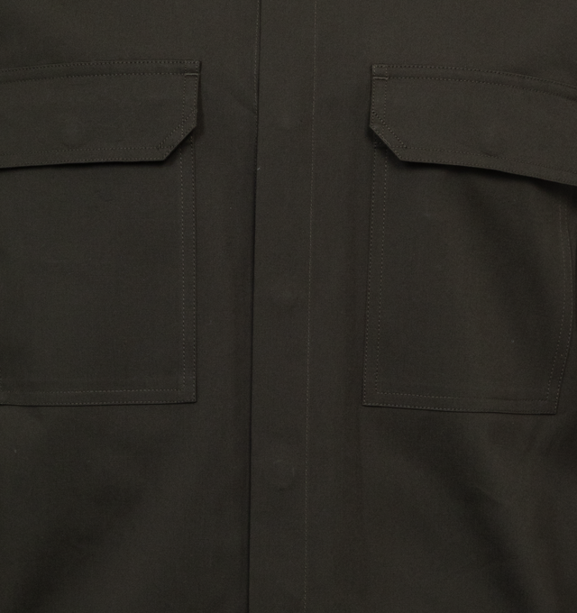 Image 3 of 3 - GREEN - Rick Owens hip-length outershirt in a boxy fit crafted from medium weight wool with a dry, papery feel. Featuring center-front opening with visible snap closures, classic collar, beveled side seams, snap cuffs, 2 square chest pockets with beveled flaps, level shoulder seams and cotton webbing strap with rivet detail on the back yoke. 96% wool / 4% elastane.  