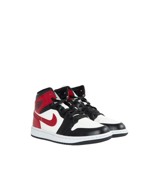 Image 2 of 4 - WHITE - AIR JORDAN 1 Mid Women's Sneakers are red, black and white sneakers made from a premium leather and synthetic upper which provides durability, comfort and support. These sneakers have an air-sole unit in the heel that delivers signature cushioning as well as has a rubber outsole that offers traction on a variety of surfaces. 