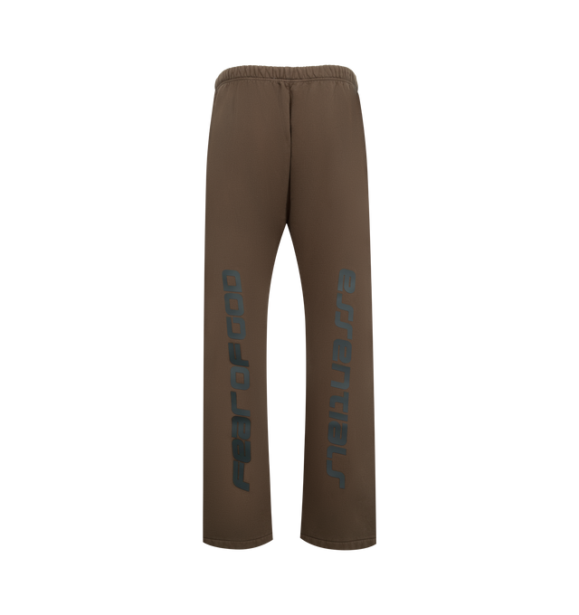Image 2 of 3 - BROWN - FEAR OF GOD ESSENTIALS Heavy Fleece Flare Sweatpant featuring 520gsm heavy fleece treated with a pigment dye, relaxed, flared-leg silhouette, HD-printed graphicsFear of God on one leg and Essentials on the other, encased elastic waistband with elongated drawcords, side seam pockets and a Fear of God Essentials rubberized label stitched at the center front. 100% cotton. 