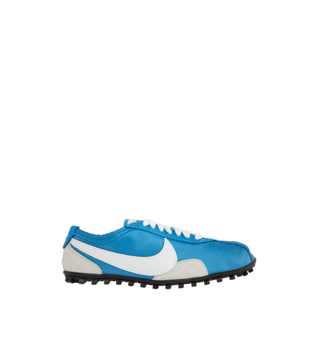 Image 1 of 5 - BLUE - Nike Men's Moon Shoe OG SP Sneakers feature an Italy Blue and Neutral Grey nylon upper with black and white accents and a leather Swoosh. Inspired by Nike's original 1970s running shoe, the streamlined silhouette is finished with a rubber Waffle outsole for durable traction. Upper: Nylon and Leather. Sole: Rubber. 